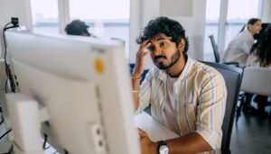 Young employee looking tired and stressed