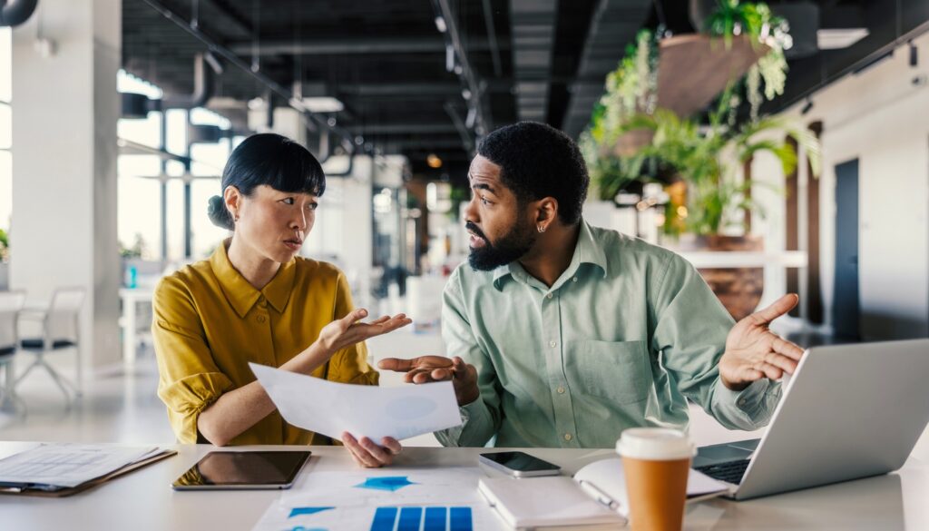Woman and man in office environment having a heated discussion