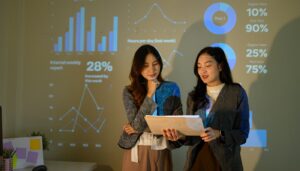 Two women looking at employee dashboard